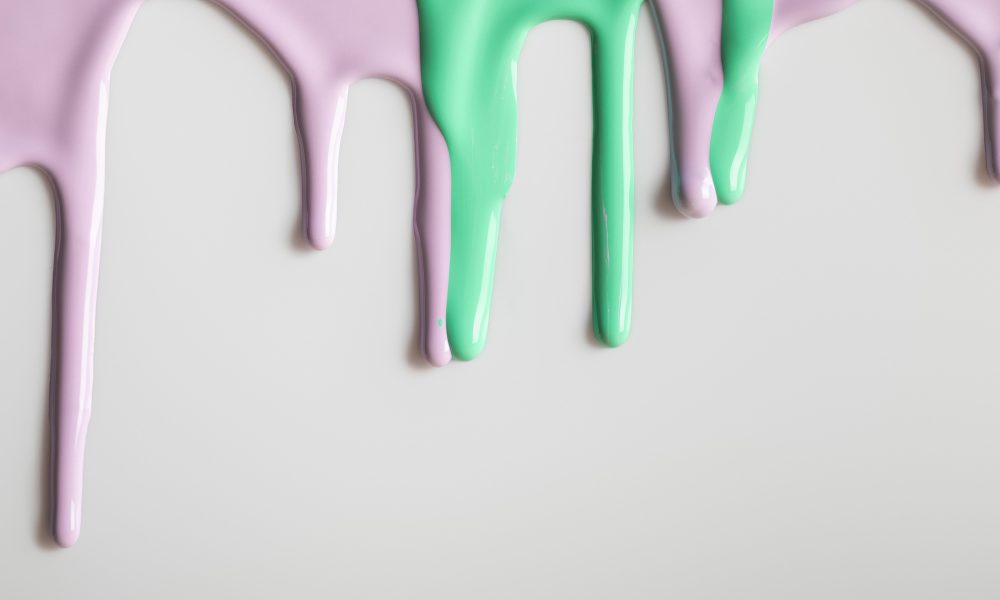 white background with purple and green flowing paints